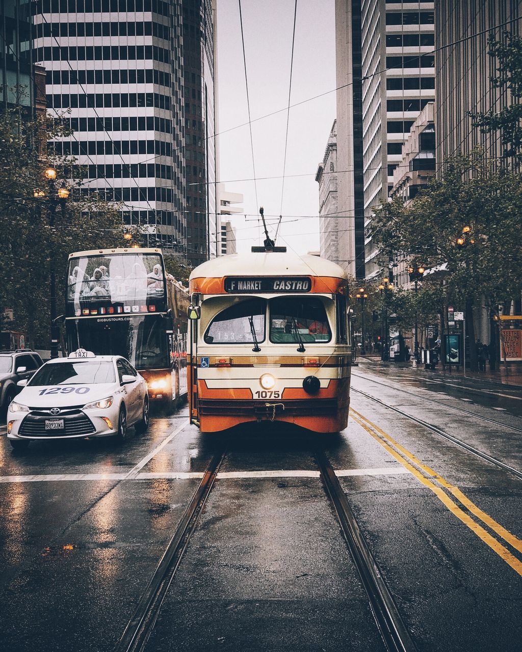 CARS ON ROAD IN CITY