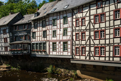 Building by river in city