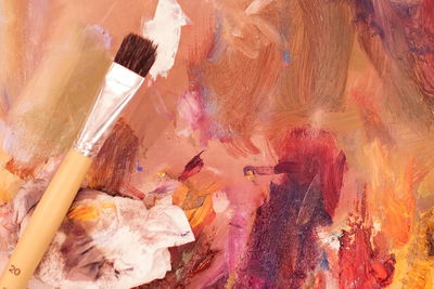 Close-up of paintbrush on painting