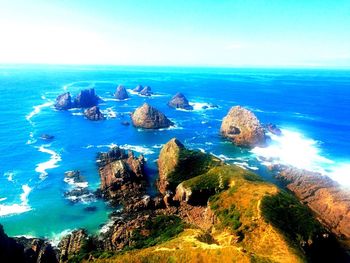 Scenic view of sea against blue sky