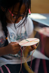 Close-up of girl holding paper