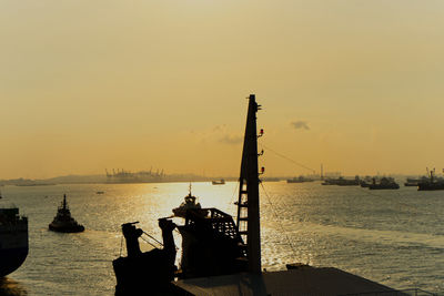 Silhouette pier on sea against sky during sunset