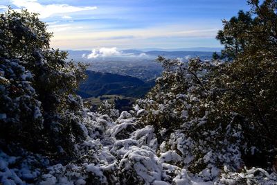 Scenic view of mountains against sky during winter