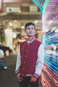 Portrait of a young man standing outdoors