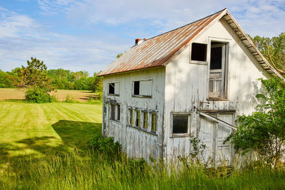 House on field against sky