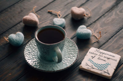 High angle view of coffee cups on table