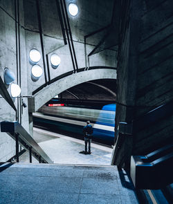 Full length of man standing by train at station