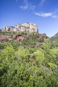 Low angle view of rock formations against sky