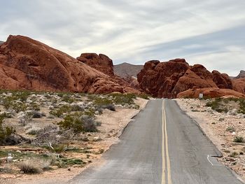 Road amidst mountain against sky