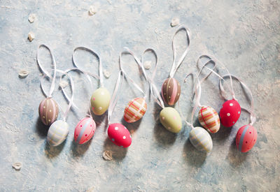 High angle view of multi colored eggs on floor