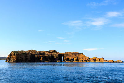 Scenic view of sea against blue sky