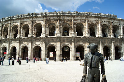 Group of people in front of historical building