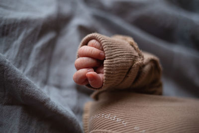 Midsection of woman holding baby