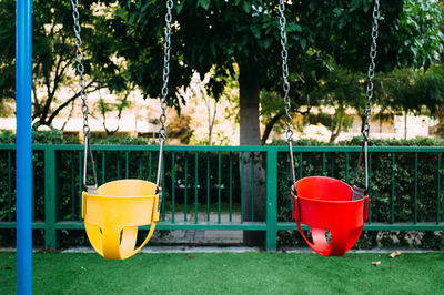 Close-up of baby swings in park