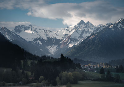 Valley and village of oberstdorf, germany in front of snowcapped mountain range of the allgäu alps.