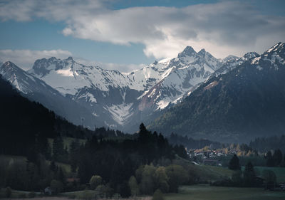 Scenic view of snowcapped mountains against sky