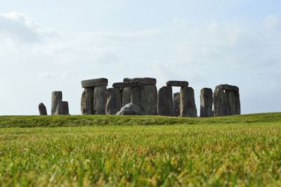 Old ruins in field against sky