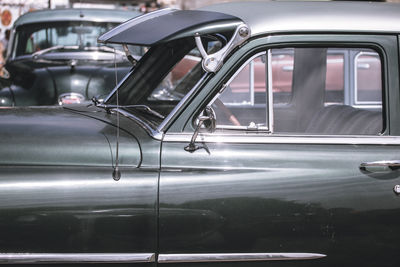 Close-up of classic cars at parking lot