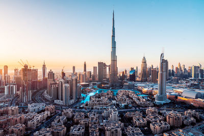 Aerial view of city buildings during sunset