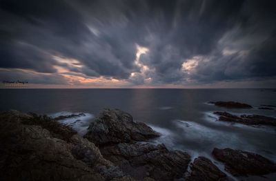 Scenic view of sea against dramatic sky