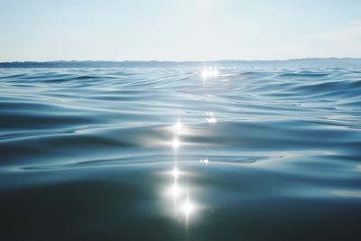 Surface level view of sea on sunny day