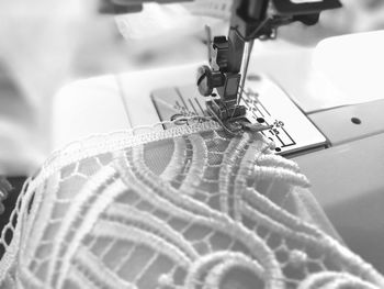 Close-up of machine stitching cloth