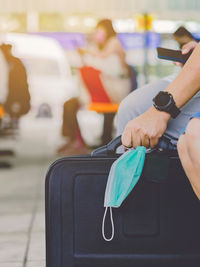 Close-up of hand holding mobile phone