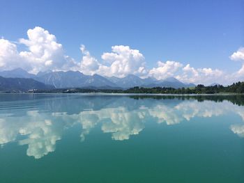 Scenic view of lake against cloudy sky