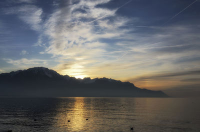 Scenic view of lake against sky during sunset