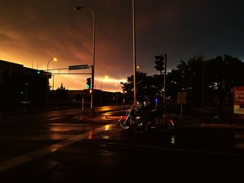 View of illuminated street lights at night