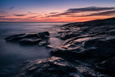 Aerial view of sea against sky during sunset