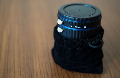 Close-up of camera lens on table