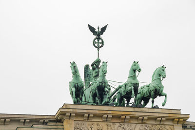 Low angle view of statue against clear sky