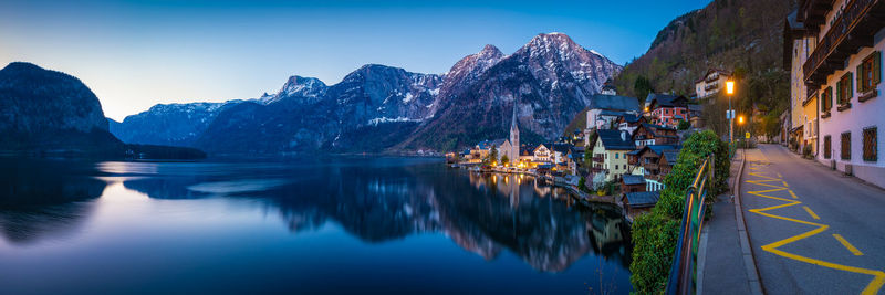 Panoramic view of lake and buildings against sky