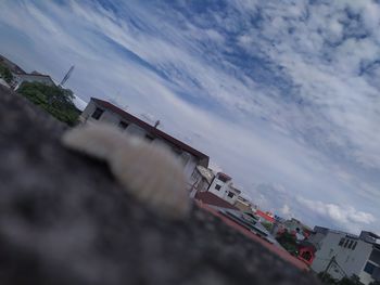 High angle view of city buildings against sky