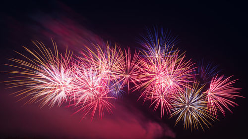Firework display at night