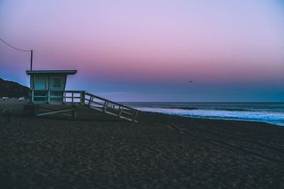 Scenic view of beach against clear sky