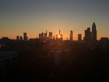 Cityscape against sky during sunset