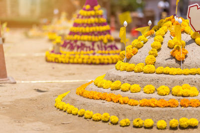 Sandcastles at temple during sunny day