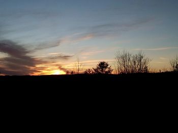 Scenic view of landscape at sunset