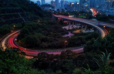 High angle view of light trails on road in city