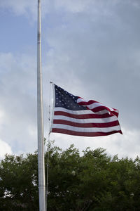 Low angle view of flag against sky