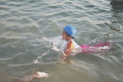 Boy swimming in sea