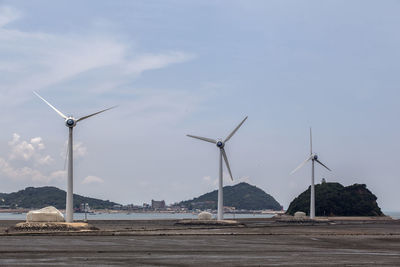 Wind turbine against sky