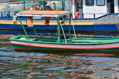 Boats moored at harbor