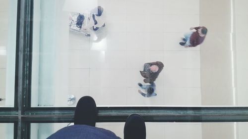 Low section of man on window