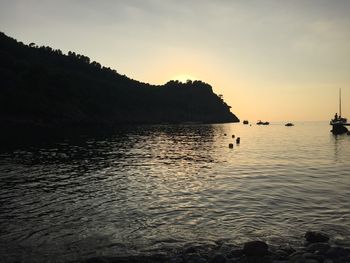 Scenic view of sea against sky at sunset