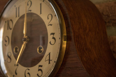 Close-up of clock on wood