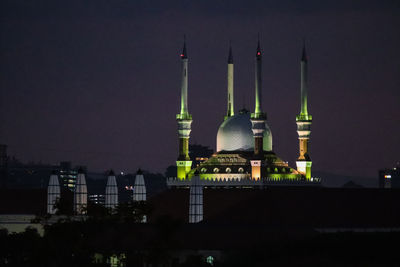 Illuminated buildings in city at night