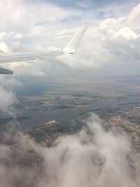 Aerial view of clouds over landscape against sky